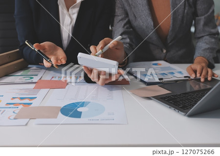 Accounting company provide finance and taxation planning for profitable cash flow, Auditor and accountant team working in office, analyze financial data and accounting record with calculator.Insight 127075266
