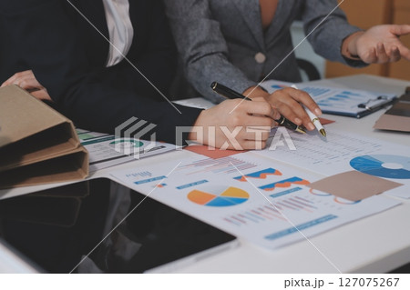 Accounting company provide finance and taxation planning for profitable cash flow, Auditor and accountant team working in office, analyze financial data and accounting record with calculator.Insight 127075267