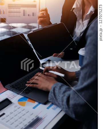 Accounting company provide finance and taxation planning for profitable cash flow, Auditor and accountant team working in office, analyze financial data and accounting record with calculator.Insight 127075273