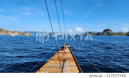 Sailing on the blue ocean towards the islands Sailing on the blue ocean towards the islands 127075548