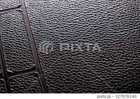 Close-up of the black rough leather surface Close-up of the black rough leather surface 127076140