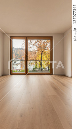 Bright modern room with large windows showcasing autumn leaves in a scenic neighborhood Bright modern room with large windows showcasing autumn leaves in a scenic neighborhood 127077345