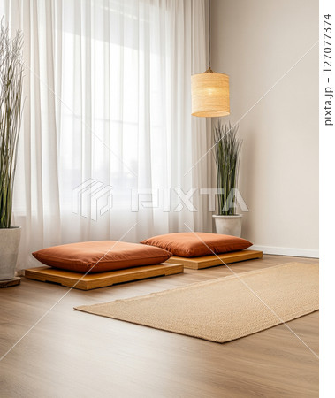 Cozy minimalist space with cushions, natural light, and plants for a serene vibe 127077374