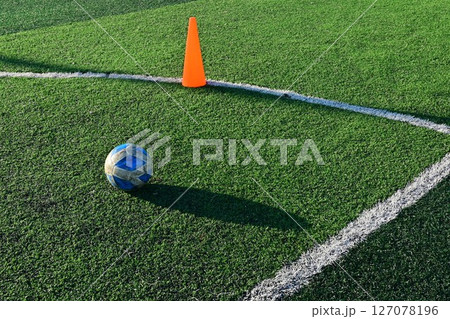 artificial green grass soccer field with training cone and ball artificial green grass soccer field with training cone and ball 127078196