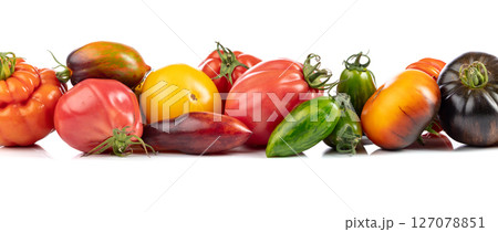Different tomatoes isolated on white background. 127078851