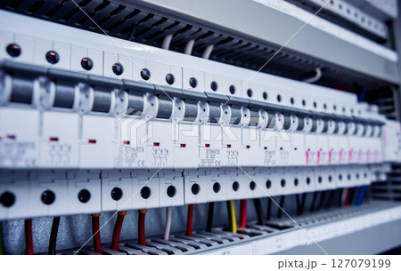 Voltage switchboard with circuit breakers. Modern electrical background. 127079199