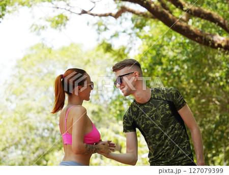 A man and a woman wearing stylish sunglasses in...の写真素材 [127079399] - PIXTA