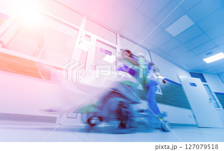 Nurse moves mobile medical chair with patient at hospital. Medical equipment. Nurse moves mobile medical chair with patient at hospital. Medical equipment. 127079518