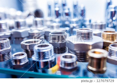 Hosepipe fittings on the table. Plumbing pipeline spare parts. Hosepipe fittings on the table. Plumbing pipeline spare parts. 127079729