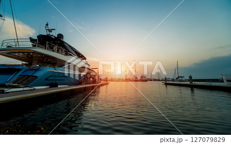 Beautiful view of marina and harbor with yachts and motorboats.  127079829