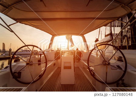 A modern speed boat yacht steering wheels. 127080148