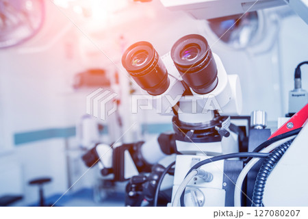Modern microscope for operations in surgery room at the hospital. Modern microscope for operations in surgery room at the hospital. 127080207