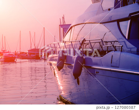 View of harbor with yachts details. Beautiful sunset sky in the marina bay. View of harbor with yachts details. Beautiful sunset sky in the marina bay. 127080387
