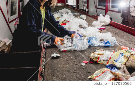 At modern recycling plant. Separate garbage collection. Workers sorting trash At modern recycling plant. Separate garbage collection. Workers sorting trash 127080566