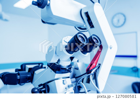 Modern microscope for operations in surgery room at the hospital. Modern microscope for operations in surgery room at the hospital. 127080581
