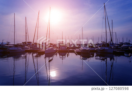 Beautiful view of marina and harbor with yachts and motorboats.  127080598