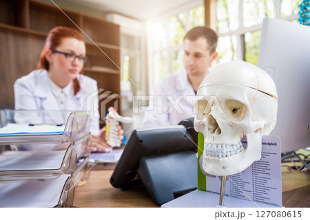 Two doctors having medical council in hospital. Discussing medical issues. 127080615