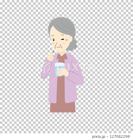 薬を飲むのを苦労するシニア女性 127082299