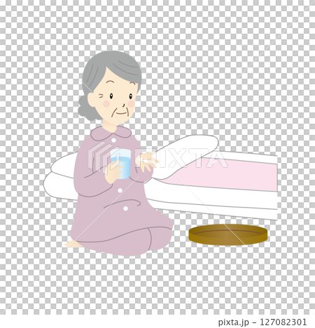 Senior woman taking medicine before bedtime 127082301
