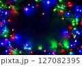 Christmas background with lights and free text space. Christmas lights. Glowing colorful Christmas lights . New Year. Garland. 127082395