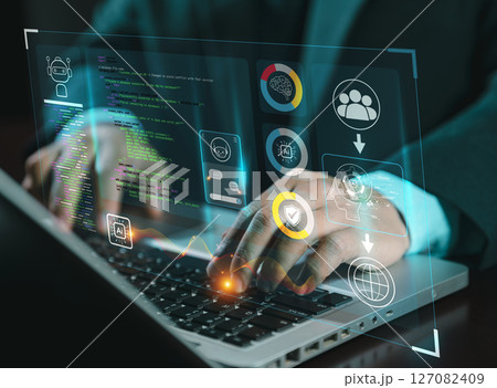 hands using typing keyboard with creative binary coding hologram on blurry background. Software programming code. Technology, web safety and programming concept. hands using typing keyboard with creative binary coding hologram on blurry background. Software programming code. Technology, web safety and programming concept. 127082409