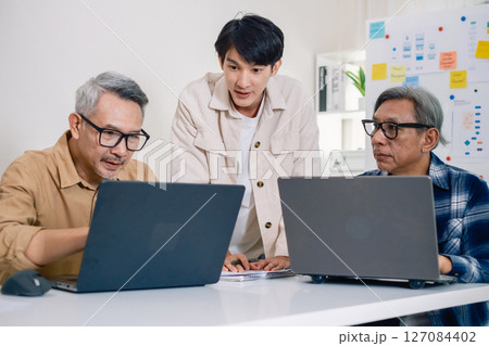 Asian Instructor Teaching Senior in Software Programming and Training Collaboration 127084402