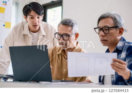 Asian Instructor Teaching Senior in Software Programming and Training Collaboration Asian Instructor Teaching Senior in Software Programming and Training Collaboration 127084415