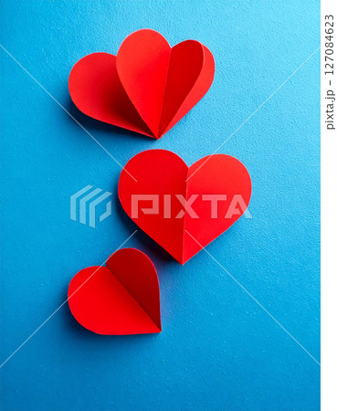 Red paper hearts hearts on blue background. top view. valentines concept. AI Generated. Red paper hearts hearts on blue background. top view. valentines concept. AI Generated. 127084623