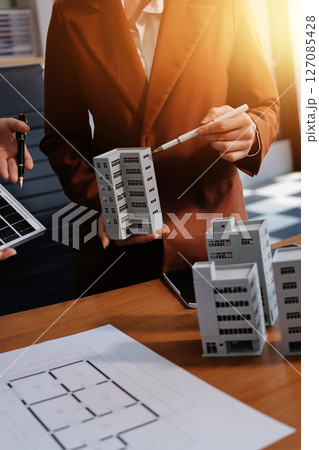 Discussion among businesspeople on the latest developments in solar cell panel technology and Solar Energy Environment city Concept. 127085428