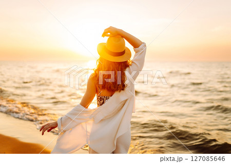Happy woman on beach in summer style fashion trend outfit carefree and happy, feeling freedom. 127085646