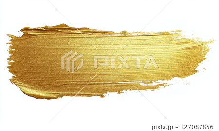 vibrant gold paint stroke on white background, showcasing smooth and glossy texture that adds elegance and warmth 127087856