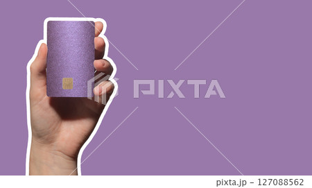 Colorful card exchange. Hand holding bright plastic bankcard with chip in closeup for credit, debit, 127088562