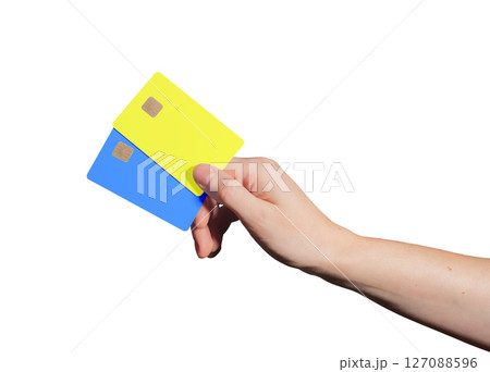 Electronic card purchase. Hand holding two fashion bankcards with chip for credit, debit, loan, Electronic card purchase. Hand holding two fashion bankcards with chip for credit, debit, loan, 127088596