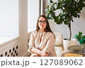 businesswoman with glasses in the office or psychologist. Portrait of a body-positive woman 127089062