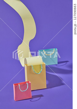 Paper-crafted shopping icons including bags and receipts decorated on purple , perfect for content related to customer journey and spending habits. Paper-crafted shopping icons including bags and receipts decorated on purple , perfect for content related to customer journey and spending habits. 127090663