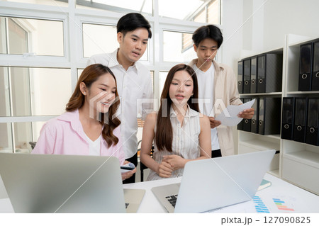 Young asian business team collaboration on project in modern office, Young asian business team collaboration on project in modern office, 127090825