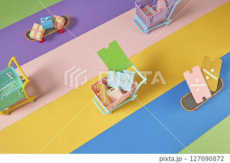 Top-down shot of colorful paper elements forming a sale scene. Shows variety in product choices and visual styles during seasonal discounts. Top-down shot of colorful paper elements forming a sale scene. Shows variety in product choices and visual styles during seasonal discounts. 127090872