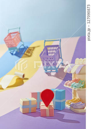 Red pins on small gift boxes and colorful shopping carts are scattered across a warm backdrop. A playful, casual layout ideal for holiday shopping campaigns. 127090873