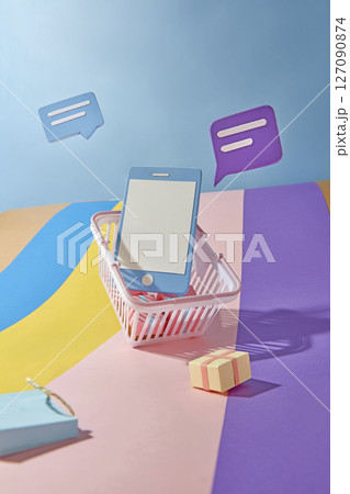 A mobile phone in a shopping cart with multiple pop up notifications on a colorful paper background. Conveys online shopping overload during big sales or events 127090874