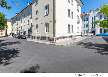 Residential Courtyard with Parked Cars and Apartment Buildings 127091798