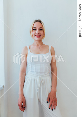 Portrait of Beautiful Slender Woman in Summer Clothes on White Background 127091889