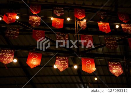 Flags at the bazaar market in Kata, Thailand 127093513
