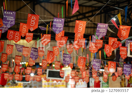 Flags at the bazaar market in Phuket, Kata, Thailand Flags at the bazaar market in Phuket, Kata, Thailand 127093557