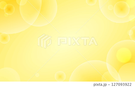中央が明るい透き通った丸い光がたくさん重なる黄色い背景 127093922