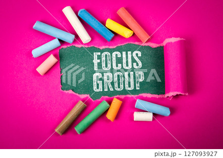 Focus Group Concept with Torn Paper and Colorful Chalk on Pink Background. Focus Group Concept with Torn Paper and Colorful Chalk on Pink Background. 127093927