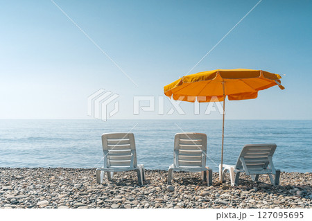 Sunny Beach with Loungers and Umbrella Sunny Beach with Loungers and Umbrella 127095695