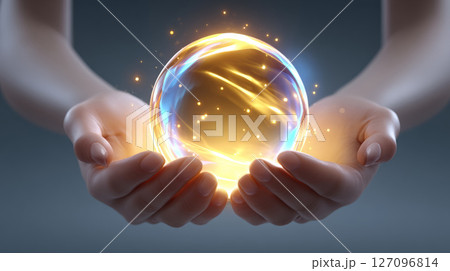 abstract hands holding orb of golden sacred energy 127096814