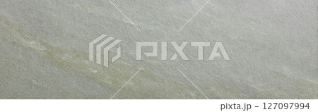 Soapstone surface in soft olive green tone with diagonal grain structure 127097994