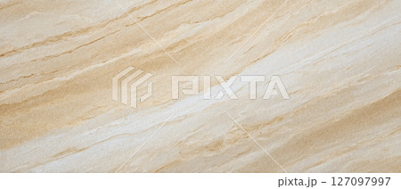Beige Travertine surface with natural parallel wave-like textures 127097997