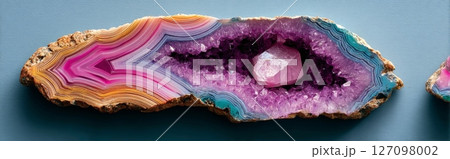 Semiprecious agate and amethyst geode slice with vivid pink and purple crystal core 127098002